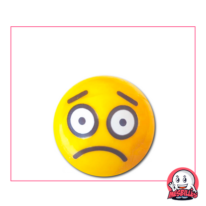 Bille jaune illustrée d’un visage triste, avec de grands yeux ronds et une bouche courbée vers le bas
