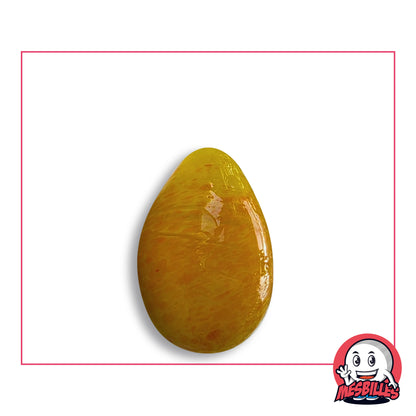 Bille Oeuf Jaune Moucheté Orange en verre jaune d'or moucheté d'orange, vue de côté, environ 25 mm de haut