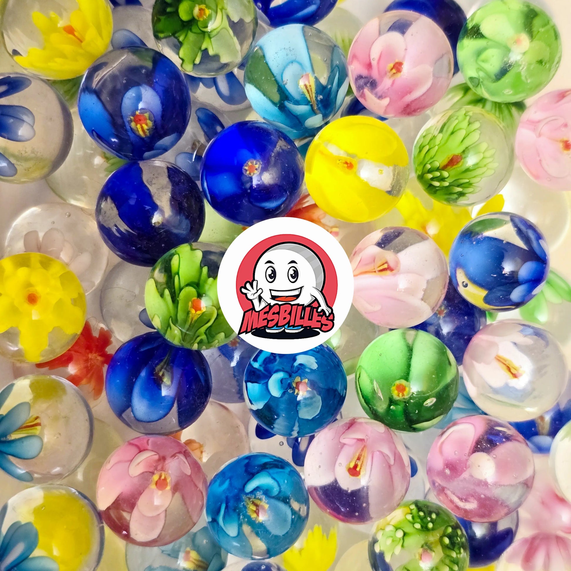 Collection de billes en verre décorées de fleurs colorées dont une bille Art Pissenlit Rouge 16 mm – MesBilles